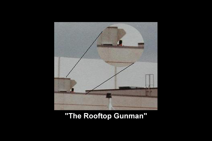 Image of a photograph of an apparent man or woman with a gun on the roof of CHS during the attack